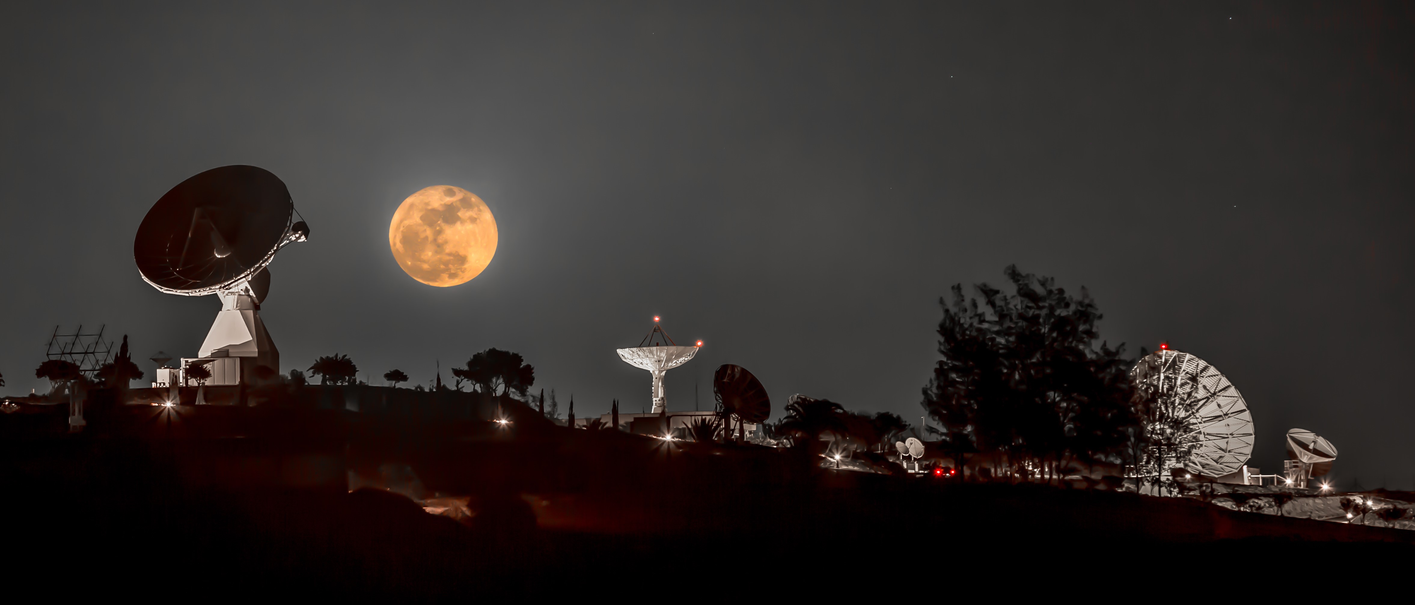 Composite image of antennas and the Moon. Credit: Claus Vogl